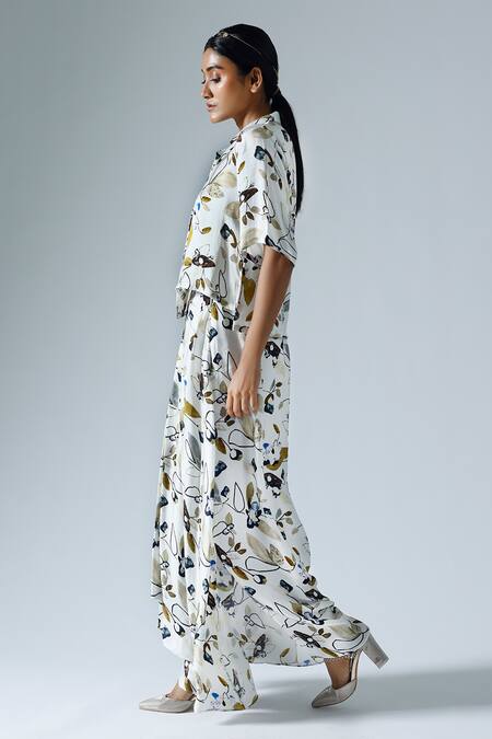 Shop Klad White Satin Printed Floral Lapel Collar Asymmetrical Top And Skirt Set Online at Aza Fashions Shop_Klad_White Satin Printed Floral Lapel Collar Asymmetrical Top And Skirt Set_Online_at_Aza_Fashions