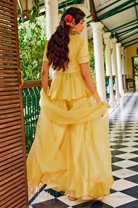 Shop 1999ad By Amita & Deepak Yellow Organza Cut Work, Embroidery, Zari V-neck Peplum Top Sharara Set at Aza Fashions Shop_1999ad By Amita & Deepak_Yellow Organza Cut Work, Embroidery, Zari V-neck Peplum Top Sharara Set _at_Aza_Fashions