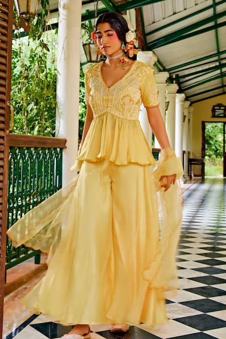 Buy 1999ad By Amita & Deepak Yellow Organza Cut Work, Embroidery, Zari V-neck Peplum Top Sharara Set Online at Aza Fashions Buy_1999ad By Amita & Deepak_Yellow Organza Cut Work, Embroidery, Zari V-neck Peplum Top Sharara Set _Online_at_Aza_Fashions
