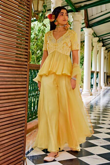Shop 1999ad By Amita & Deepak Yellow Organza Cut Work, Embroidery, Zari V-neck Peplum Top Sharara Set Online at Aza Fashions Shop_1999ad By Amita & Deepak_Yellow Organza Cut Work, Embroidery, Zari V-neck Peplum Top Sharara Set _Online_at_Aza_Fashions
