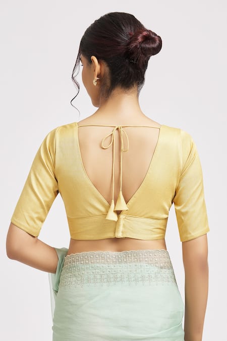 Shop Naintara Bajaj Gold Silk Plunge Neck V Plain Blouse at Aza Fashions Shop_Naintara Bajaj_Gold Silk Plunge Neck V Plain Blouse _at_Aza_Fashions
