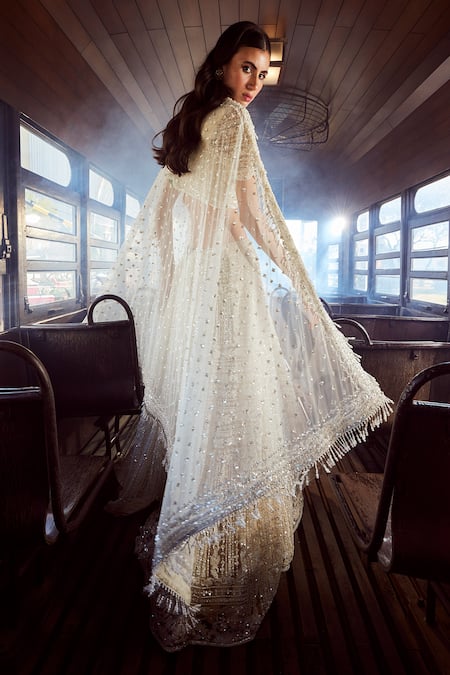 Shop Rococo Ivory Net Sequins, Cut Work Scoop Arcadia Floral Embroidered Bridal Lehenga Set at Aza Fashions Shop_Rococo_Ivory Net Sequins, Cut Work Scoop Arcadia Floral Embroidered Bridal Lehenga Set _at_Aza_Fashions