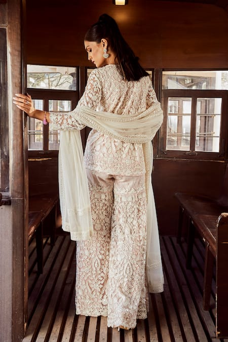 Shop Rococo Pink Net Embroidery, Sequins, Cut Seraphic Charm Thread Short Tunic Sharara Set at Aza Fashions Shop_Rococo_Pink Net Embroidery, Sequins, Cut Seraphic Charm Thread Short Tunic Sharara Set _at_Aza_Fashions