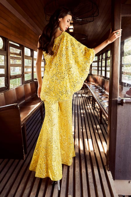 Shop Rococo Yellow Net Embroidery, Mirrors One Shoulder Ambre Tunic With Sharara at Aza Fashions Shop_Rococo_Yellow Net Embroidery, Mirrors One Shoulder Ambre Tunic With Sharara _at_Aza_Fashions