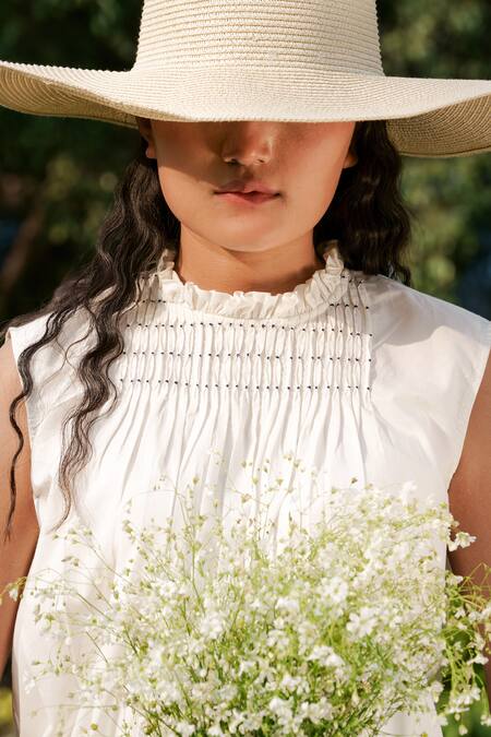 Ahmev_Ivory Cotton Tassels Round Neck Pintuck Placement Top _at_Aza_Fashions