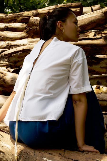 Shop Three White Cotton, Tencel Round Neck Asymmetric Pleated Top And Pant Set at Aza Fashions Shop_Three_White Cotton, Tencel Round Neck Asymmetric Pleated Top And Pant Set _at_Aza_Fashions