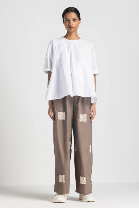 Three White Poplin Embroidery Round Neck Asymmetric Pleated Top And Pant Set Online at Aza Fashions Three_White Poplin Embroidery Round Neck Asymmetric Pleated Top And Pant Set _Online_at_Aza_Fashions