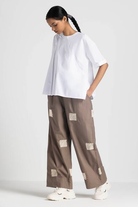 Shop Three White Poplin Embroidery Round Neck Asymmetric Pleated Top And Pant Set Online at Aza Fashions Shop_Three_White Poplin Embroidery Round Neck Asymmetric Pleated Top And Pant Set _Online_at_Aza_Fashions