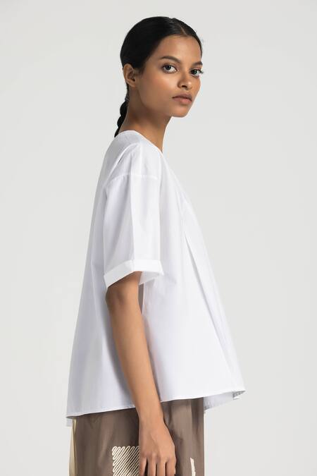 Three White Poplin Embroidery Round Neck Asymmetric Pleated Top And Pant Set at Aza Fashions Three_White Poplin Embroidery Round Neck Asymmetric Pleated Top And Pant Set _at_Aza_Fashions