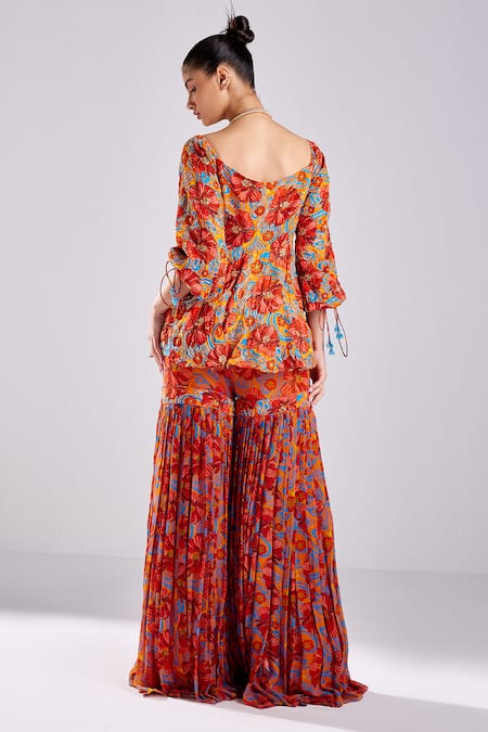 Shop Diyarajvvir Orange Georgette, Modal, Tulle Botanic Print Peplum Kurta With Gharara at Aza Fashions Shop_Diyarajvvir_Orange Georgette, Modal, Tulle Botanic Print Peplum Kurta With Gharara _at_Aza_Fashions