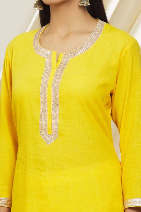 Buy Peenacolada Yellow Cotton, Muslin Gota Patti, Zari, Foil Printing Round Neck Gharara Set Online at Aza Fashions Buy_Peenacolada_Yellow Cotton, Muslin Gota Patti, Zari, Foil Printing Round Neck Gharara Set _Online_at_Aza_Fashions
