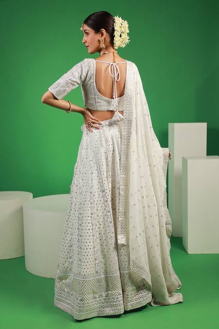 Shop Kohsh White Georgette Mirrors V-neck Mukaish Floral Embroidered Lehenga Set at Aza Fashions Shop_Kohsh_White Georgette Mirrors V-neck Mukaish Floral Embroidered Lehenga Set_at_Aza_Fashions