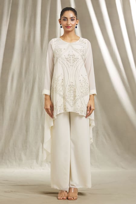Shivani Awasty_Ivory Georgette Sequins, Cut Work, Embroidered Asymmetric Tunic And Pant Set _at_Aza_Fashions