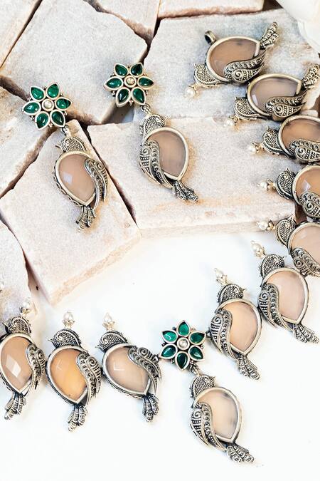 Shop Mero Jewellery Pink Rhinestones, Stones Tribal Bird Carved Hasli Necklace Set at Aza Fashions Shop_Mero Jewellery_Pink Rhinestones, Stones Tribal Bird Carved Hasli Necklace Set_at_Aza_Fashions