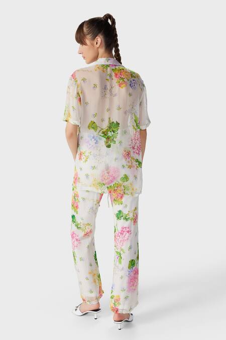 Shop The Iaso Off White Modal Embroidery Floral Print Flared Pant at Aza Fashions Shop_The Iaso_Off White Modal Embroidery Floral Print Flared Pant _at_Aza_Fashions