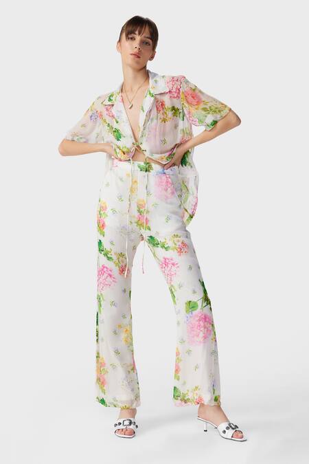 The Iaso Off White Modal Embroidery Floral Print Flared Pant Online at Aza Fashions The Iaso_Off White Modal Embroidery Floral Print Flared Pant _Online_at_Aza_Fashions