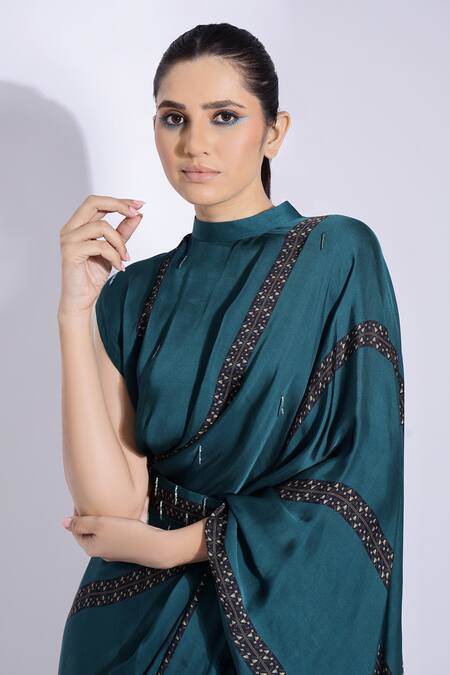 Studio Surbhi Green Georgette, Satin Tassels, Pre-stitched Saree With Embellished Blouse at Aza Fashions Studio Surbhi_Green Georgette, Satin Tassels, Pre-stitched Saree With Embellished Blouse _at_Aza_Fashions