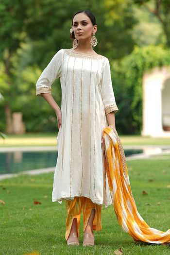 Nazar By Indu White Cotton Embroidery, Gota Patti Boat Neck Kurta Ikat Print Pant Set at Aza Fashions Nazar By Indu_White Cotton Embroidery, Gota Patti Boat Neck Kurta Ikat Print Pant Set _at_Aza_Fashions