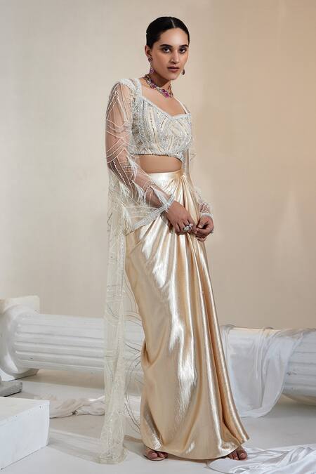 Swati Wadhwani Couture Beige Satin, Net, Crepe Embroidery V-neck Off-shoulder Blouse Skirt Set Online at Aza Fashions Swati Wadhwani Couture_Beige Satin, Net, Crepe Embroidery V-neck Off-shoulder Blouse Skirt Set _Online_at_Aza_Fashions