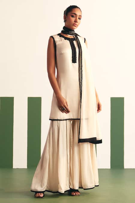 Shop_Reeti Arneja - Theklub_Ivory Cotton Satin, Organza Sequins Enora Embroidered Yoke Kurta Sharara Set _at_Aza_Fashions