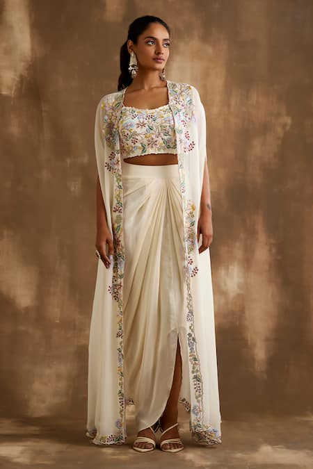 Buy Niamh By Kriti Ivory Silk Embroidery, Cut Work Square Neck Floral Border Cape Draped Skirt Set Online at Aza Fashions Buy_Niamh By Kriti_Ivory Silk Embroidery, Cut Work Square Neck Floral Border Cape Draped Skirt Set _Online_at_Aza_Fashions