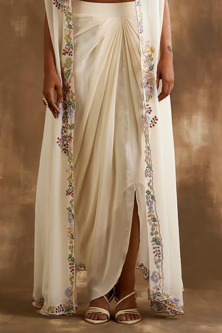 Shop Niamh By Kriti Ivory Silk Embroidery, Cut Work Square Neck Floral Border Cape Draped Skirt Set Online at Aza Fashions Shop_Niamh By Kriti_Ivory Silk Embroidery, Cut Work Square Neck Floral Border Cape Draped Skirt Set _Online_at_Aza_Fashions