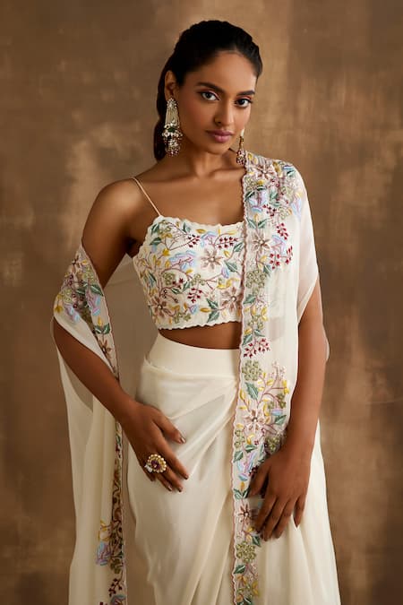 Niamh By Kriti Ivory Silk Embroidery, Cut Work Square Neck Floral Border Cape Draped Skirt Set at Aza Fashions Niamh By Kriti_Ivory Silk Embroidery, Cut Work Square Neck Floral Border Cape Draped Skirt Set _at_Aza_Fashions