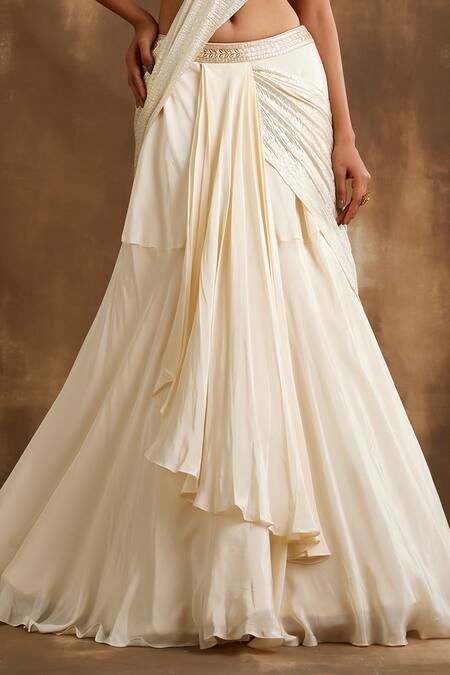 Niamh By Kriti Ivory Silk, Crepe Sequins, Cut Work One Attached Draped Lehenga With Blouse Online at Aza Fashions Niamh By Kriti_Ivory Silk, Crepe Sequins, Cut Work One Attached Draped Lehenga With Blouse _Online_at_Aza_Fashions