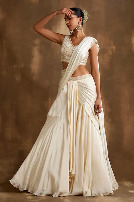 Niamh By Kriti Ivory Silk, Crepe Sequins, Cut Work One Attached Draped Lehenga With Blouse at Aza Fashions Niamh By Kriti_Ivory Silk, Crepe Sequins, Cut Work One Attached Draped Lehenga With Blouse _at_Aza_Fashions