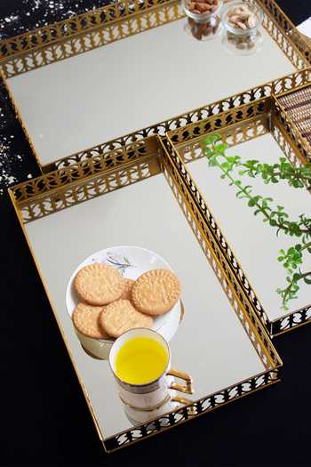 Buy Assemblage Gold Brass Polish Iron And Mirror Rectangular Tray Set Of 3 at Aza Fashions Buy_Assemblage_Gold Brass Polish Iron And Mirror Rectangular Tray Set Of 3_at_Aza_Fashions