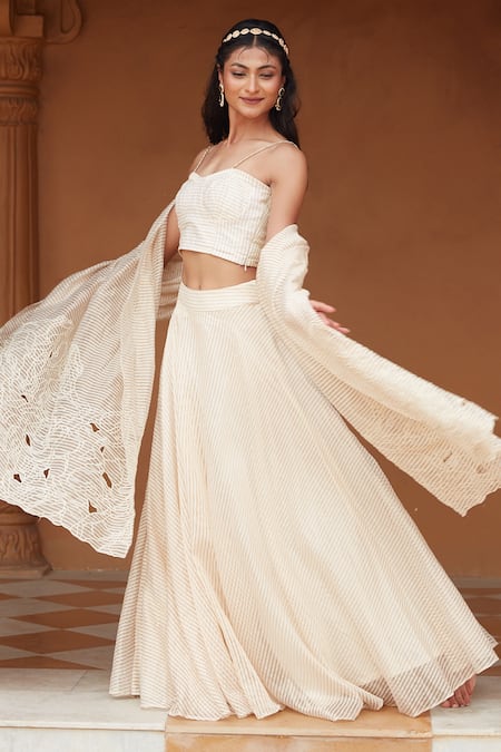 Buy Chambray & CO. Ivory Handloom Cotton Cut Work Isra Stripe Pattern Bustier Lehenga Set Online at Aza Fashions Buy_Chambray & CO._Ivory Handloom Cotton Cut Work Isra Stripe Pattern Bustier Lehenga Set _Online_at_Aza_Fashions