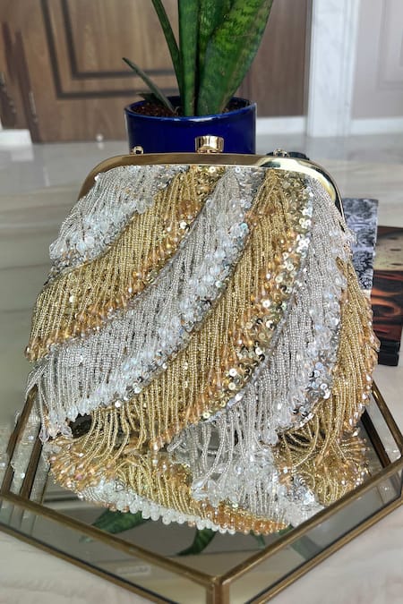 Buy Gold Embroidery Sequin Bag by Adorn My Wish Online at Aza Fashions.