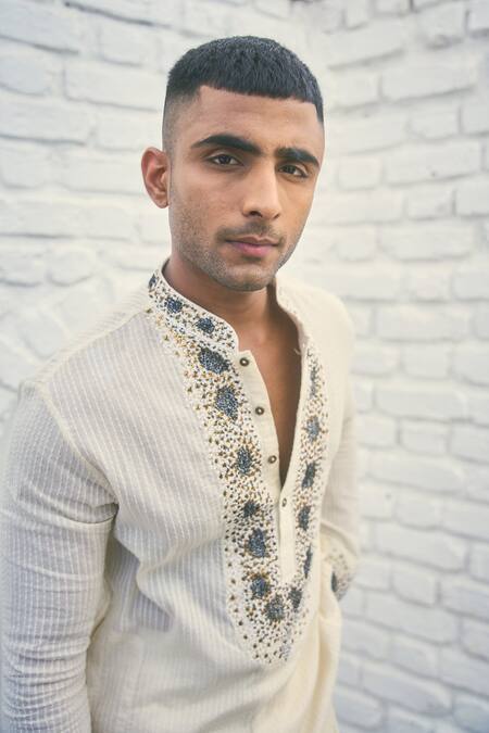 Shop_Nafs_Off White Cotton Embroidery Rose Thread Yoke Kurta Set_at_Aza_Fashions