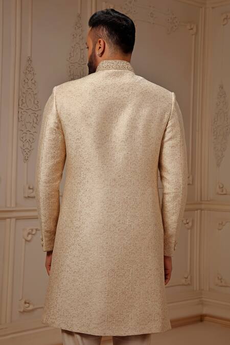 Shop Vanshik Cream Silk Mughal Bloom Pattern Sherwani Set at Aza Fashions Shop_Vanshik_Cream Silk Mughal Bloom Pattern Sherwani Set_at_Aza_Fashions