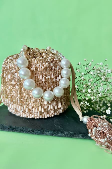 Shop Nayaab By Sonia Pink Embroidery Frost Tassel Embellished Bucket Bag at Aza Fashions Shop_Nayaab By Sonia_Pink Embroidery Frost Tassel Embellished Bucket Bag _at_Aza_Fashions