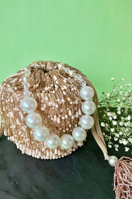 Buy Nayaab By Sonia Pink Embroidery Frost Tassel Embellished Bucket Bag Online at Aza Fashions Buy_Nayaab By Sonia_Pink Embroidery Frost Tassel Embellished Bucket Bag _Online_at_Aza_Fashions