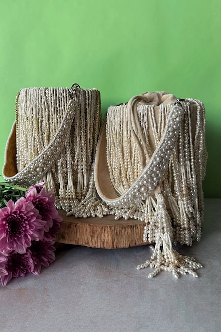Nayaab By Sonia_Off White Pearls Gilt Cascade Tassel Embellished Potli _Online_at_Aza_Fashions