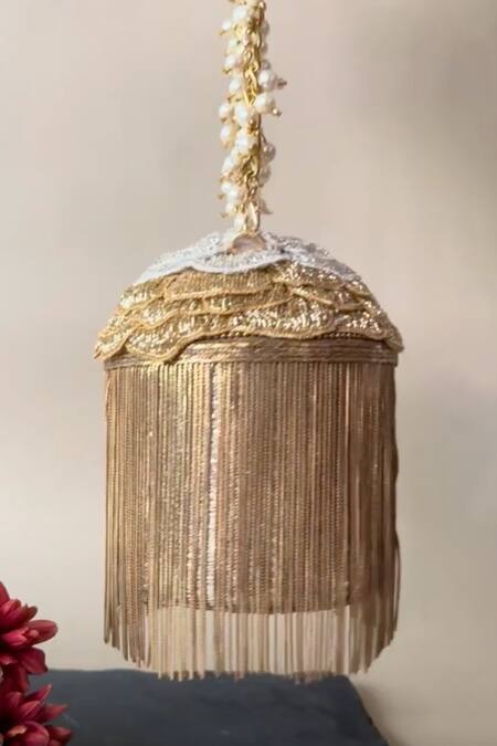 Shop Nayaab By Sonia Gold Embroidery, Cut Work Hinted Cascade Luxe Tassel Embellished Potli Online at Aza Fashions Shop_Nayaab By Sonia_Gold Embroidery, Cut Work Hinted Cascade Luxe Tassel Embellished Potli _Online_at_Aza_Fashions