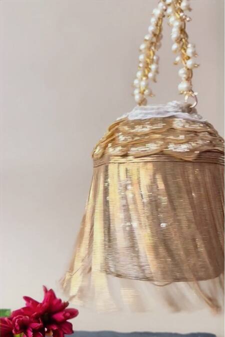 Nayaab By Sonia Gold Embroidery, Cut Work Hinted Cascade Luxe Tassel Embellished Potli at Aza Fashions Nayaab By Sonia_Gold Embroidery, Cut Work Hinted Cascade Luxe Tassel Embellished Potli _at_Aza_Fashions