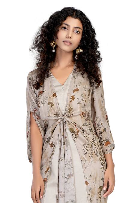 Whimsical By Shica_Ivory Organza, Satin V-neck Flora Print Front Tie-up Jumpsuit _Online_at_Aza_Fashions