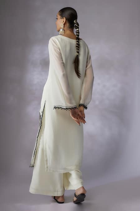Shop Shreeka Ivory Viscose, Georgette, Crepe Floral Applique Placement Kurta With Palazzo at Aza Fashions Shop_Shreeka_Ivory Viscose, Georgette, Crepe Floral Applique Placement Kurta With Palazzo _at_Aza_Fashions