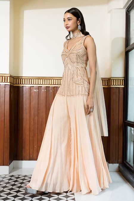 Shop Mehak Sharma Peach Net, Crepe Cut Work, Sequins, Embroidery V-neck Kurta Sharara Set Online at Aza Fashions Shop_Mehak Sharma_Peach Net, Crepe Cut Work, Sequins, Embroidery V-neck Kurta Sharara Set _Online_at_Aza_Fashions
