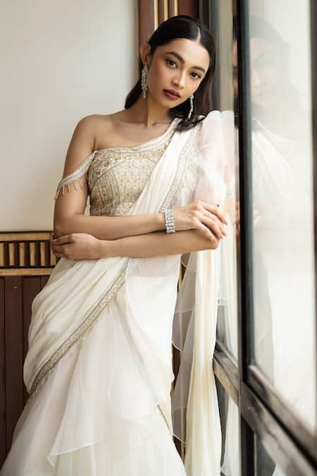 Mehak Sharma Ivory Organza, Crepe Pearls, Sequins, Ruffle Border Pre Draped Saree With Blouse Online at Aza Fashions Mehak Sharma_Ivory Organza, Crepe Pearls, Sequins, Ruffle Border Pre Draped Saree With Blouse _Online_at_Aza_Fashions