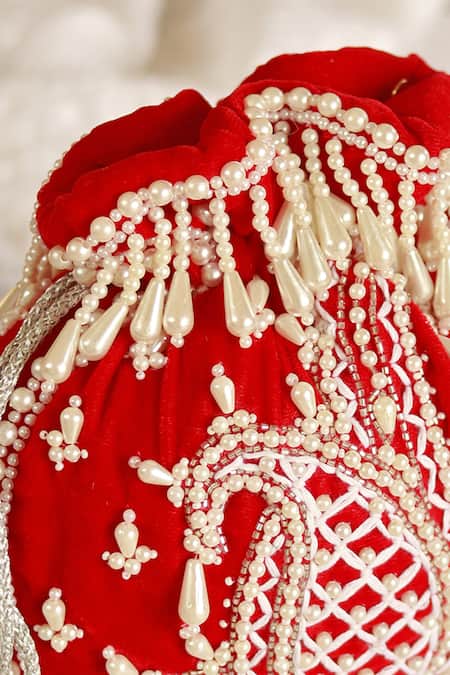 The Tan Clan_Red Pearls Sukoon Embellished Potli _at_Aza_Fashions