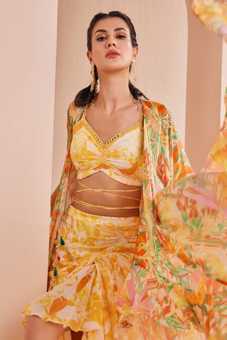 Mandira Wirk - Indian Yellow Chiffon Embroidery, Mirrors V-neck Fluorescent Cape Skirt Set Online at Aza Fashions Mandira Wirk - Indian_Yellow Chiffon Embroidery, Mirrors V-neck Fluorescent Cape Skirt Set _Online_at_Aza_Fashions