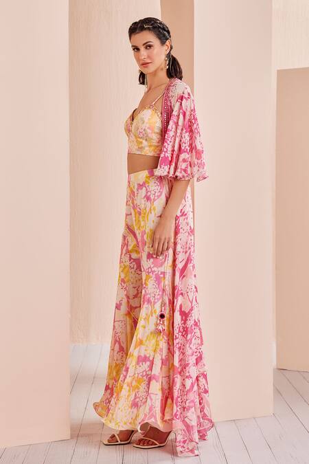 Buy Mandira Wirk - Indian Pink Chiffon Tassels V-neck Floral Print Sharara Set With Cape Online at Aza Fashions Buy_Mandira Wirk - Indian_Pink Chiffon Tassels V-neck Floral Print Sharara Set With Cape _Online_at_Aza_Fashions