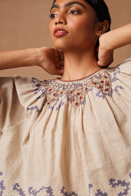 Shop_Cord_Ivory Cotton Embroidery Round Neck Rose Spiral Print Flared Top_Online_at_Aza_Fashions