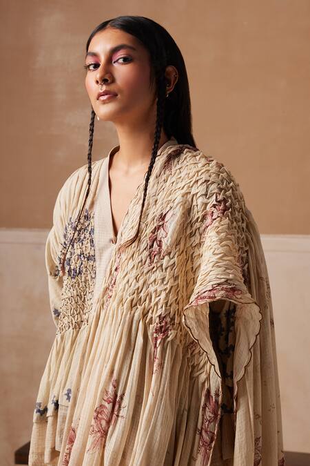 Shop_Cord_Ivory Cotton Embroidery Shawl Neck Spiral Print Smocked Saree With Peplum Top_Online_at_Aza_Fashions