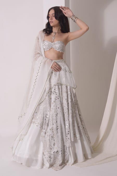 Shwetanga White Organza, Crepe Sequins, Embellished Asymmetric Layered Lehenga Bustier Set at Aza Fashions Shwetanga_White Organza, Crepe Sequins, Embellished Asymmetric Layered Lehenga Bustier Set _at_Aza_Fashions