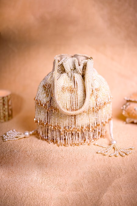Shop House Of Kosha Ivory Pearls, Beads, Crystals Rayna Embellished Potli Bag at Aza Fashions Shop_House Of Kosha_Ivory Pearls, Beads, Crystals Rayna Embellished Potli Bag _at_Aza_Fashions